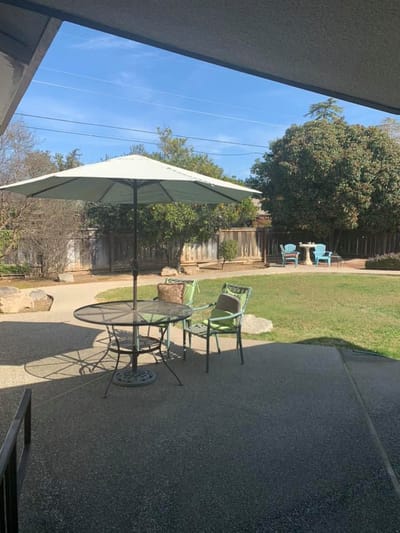 Outdoor seating area with patio and garden