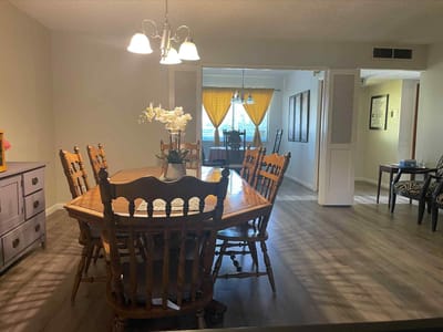 Bright dining room with large wooden table
