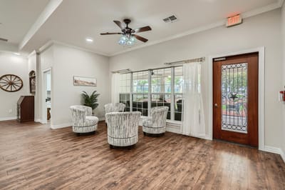 Bright and inviting common area with seating and windows
