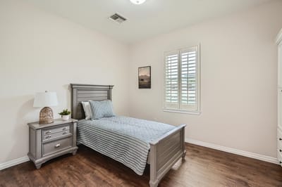 Cozy private resident room with a bed and nightstand