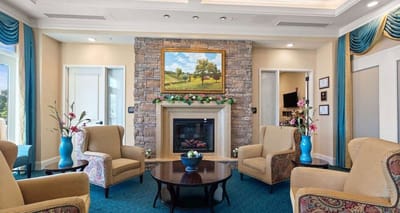 Comfortable lounge area with a fireplace and artwork