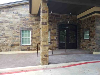 Exterior view of the facility entrance with stone details