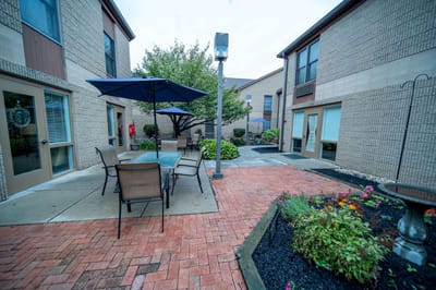 Outdoor courtyard with seating and gardens