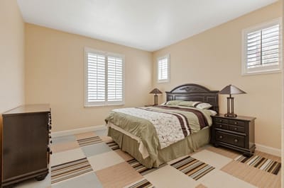 Cozy private room with a bed and furniture