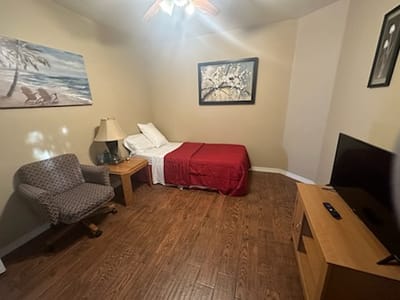 Cozy private room with a bed and seating area
