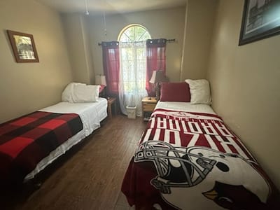 A cozy resident room with two beds