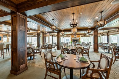 Elegant dining room with wooden decor and tables