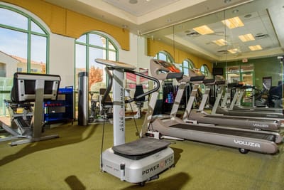 Well-equipped fitness room with treadmills and exercise equipment