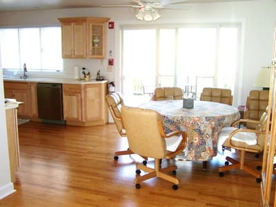 Bright interior common area with dining table and chairs