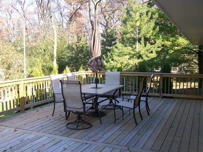 Outdoor patio area with seating and umbrella