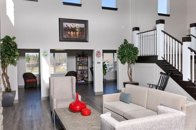 Bright common area with comfortable seating and decor