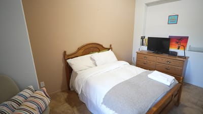 Cozy private resident room with bedding and furniture