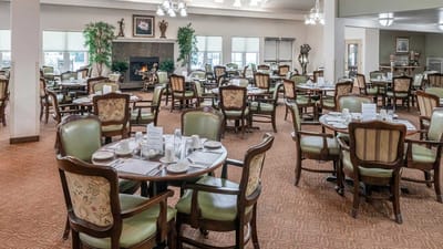 Dining room with tables set for residents