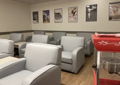 Common area with seating and movie posters