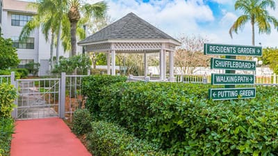 Pathway leading to a gazebo and garden area