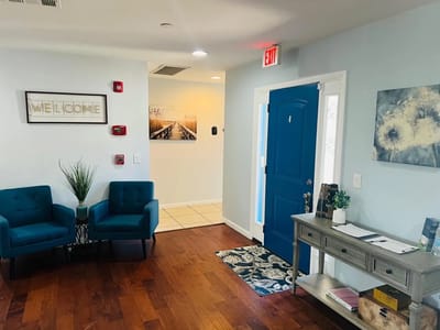 Bright interior lobby with blue decor and seating