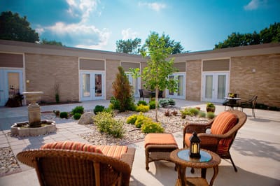 Outdoor courtyard with seating and landscaping