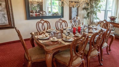 Elegantly set dining table with fine china and glassware