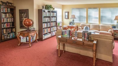 Cozy common area with bookshelves and seating
