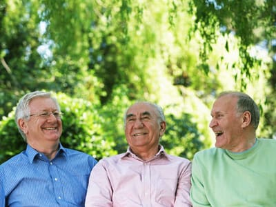 Three elderly men enjoying time outdoors