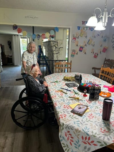 Residents celebrating a birthday in a common area
