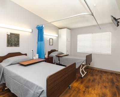 Interior view of a shared resident room with two beds
