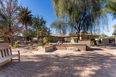 Outdoor courtyard with seating and landscaping features