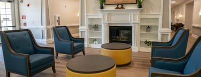Bright common area with seating around a coffee table