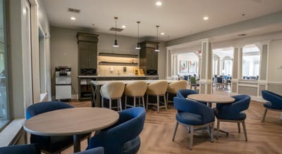 Bright common area with seating and kitchen