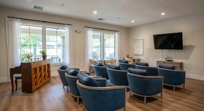 Interior common area with seating and large windows