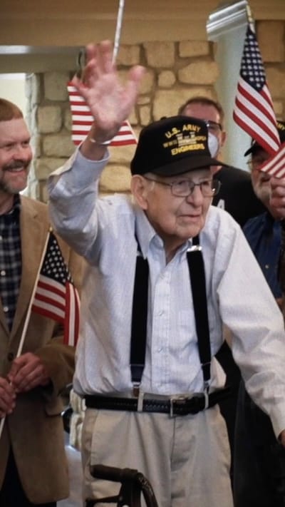 Resident celebrating with American flags