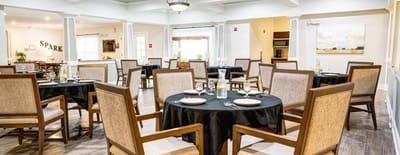 Dining area set up with tables and chairs