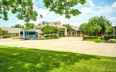 Exterior view of Dogwood Trails with entrance and vehicle