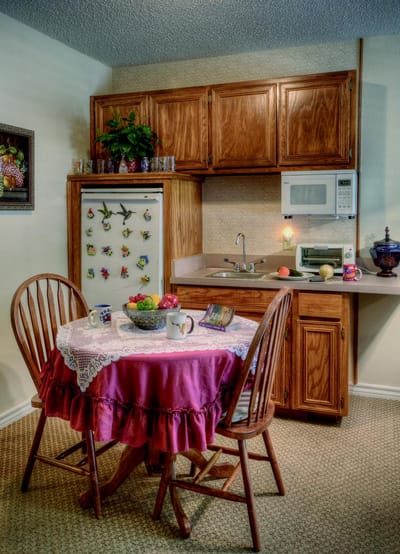 Cozy kitchenette with a table and fruit bowl