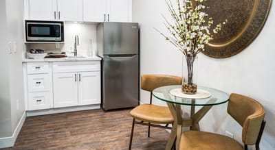 Cozy kitchenette with dining table and chairs
