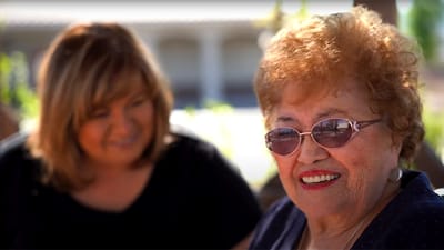 Residents enjoying time outdoors, smiling together