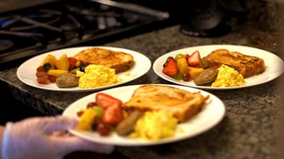 Three plated meals prepared for residents