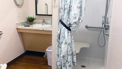 Private bathroom with a shower and sink