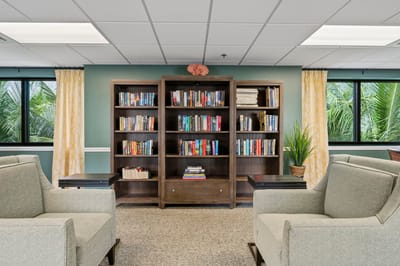 Cozy reading area with bookshelves and comfortable seating