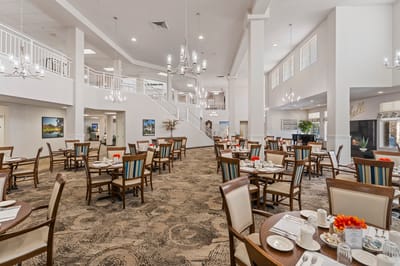Dining area set up for residents with tables and chairs