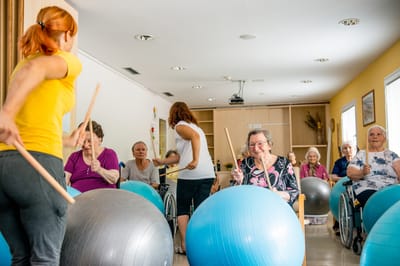 Residents participating in an exercise class with fitness balls