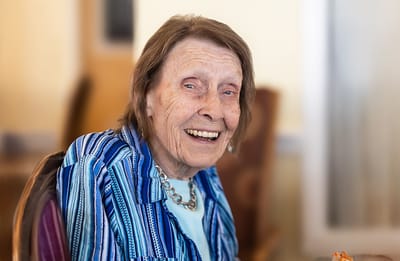 Smiling older woman in a senior living facility