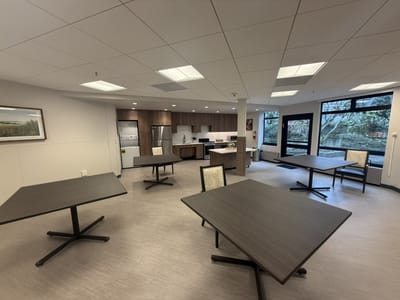 Bright common area with tables and chairs