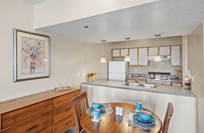 Interior view of a dining area with kitchen