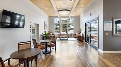Bright interior common area with seating and decor