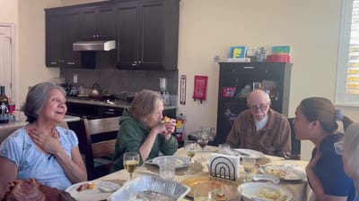Seniors enjoying a meal together in a dining room