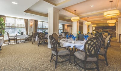 Elegant dining room setup with tables and chairs