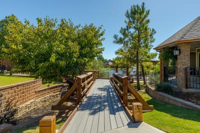 Wooden bridge leading to a scenic outdoor area near the facility