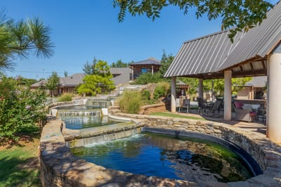 Beautiful outdoor space with water features and seating