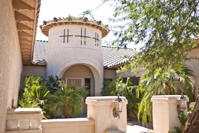 Exterior view of Legacy Assisted Living Home with landscaping